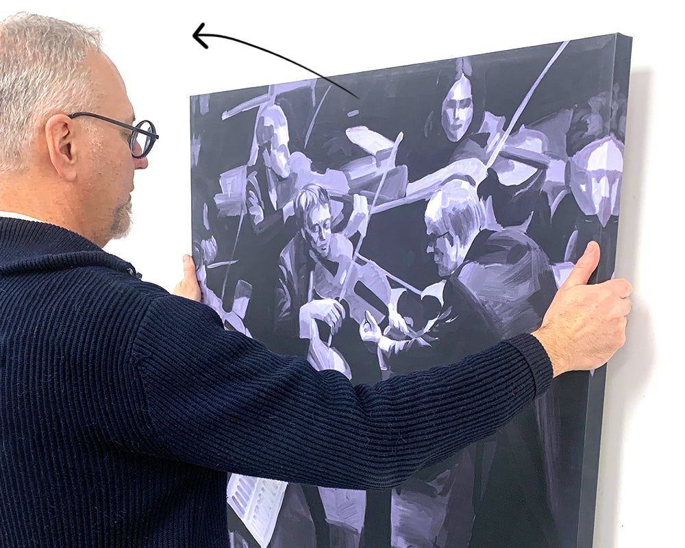 How do you take down a canvas picture after hanging it with CanvasHangers™?